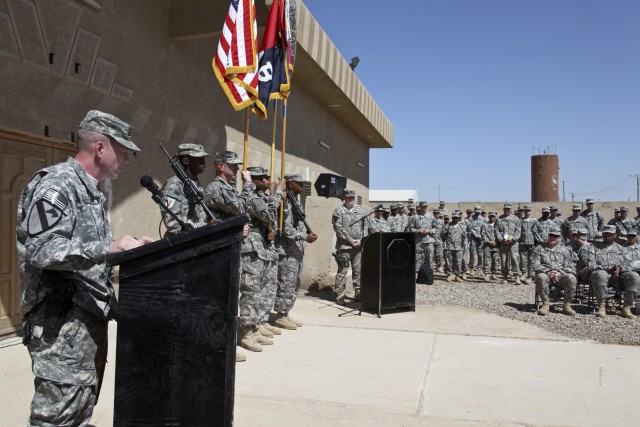 CAMP TAJI, Iraq—Col. Douglas Gabram (center), from Cleveland, commander, 1st Air Cavalry Brigade, 1st Cavalry Division, addresses Soldiers from the 1st ACB and Combat Aviation Brigade, 1st Infantry Division, following the Transfer of Authority...