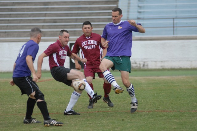 The Internationals' Ray Shisler, far left, and Aaron Angel, far right, battle with Rock Force's Byron Braswell, left middle, and Jose Ballejo, right middle, for the ball Monday at Doughboy Stadium. The Internationals defeated Rock Force 1-0 in...