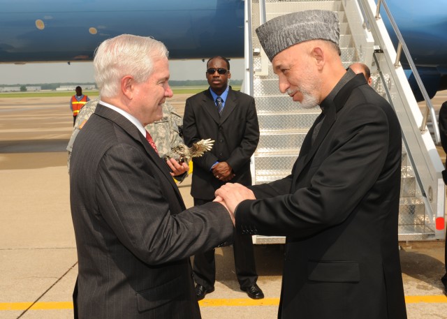 Karzai greets Gates