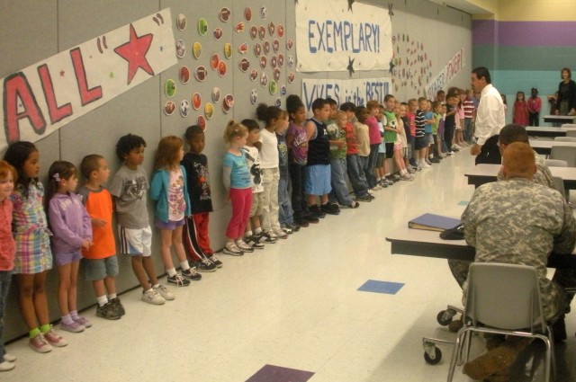 FORT HOOD, Texas-Kindergarten students from Venable Village Elementary School give an extra special "Thank You!," to the troopers of 2nd Battalion, 7th Cavalry Regiment, 4th Brigade Combat Team, 1st Cavalry Division.  The Soldiers contributed more th...
