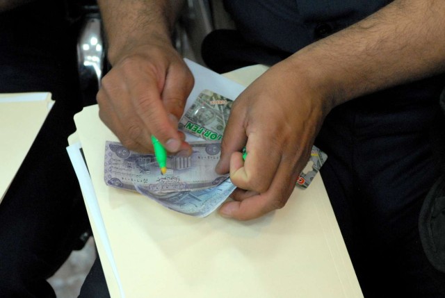 Iraqi Police confront counterfeiting