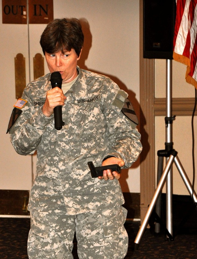 FORT HOOD, Texas-Chaplain (Lt. Col.) Barbara Sherer, a Springfield, Mo. native, chaplain for the 1st Cavalry Division, holds her outdated GPS system which helped her to get through Iraq during a tough time. She related using her GPS to the theme of t...