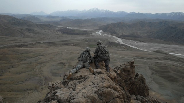 U.S. Army 1st Lt. Larry Baca, right, shows 1st Lt. Jared Tomberlin the view of a valley from a ridge near Forward Operating Base Lane in the Zabul province of Afghanistan, Feb. 21, 2009. In March 2010, photographer Staff Sgt. Adam Mancini, Joint Mult...