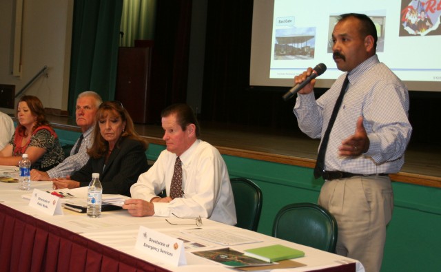 From left, Angela Moncur, Fort Huachuca Garrison Public Affairs officer; Dennis Maruska, director of Family and Morale, Welfare and Recreation; Sylvia Pete, chief, Housing Division; and John Ruble, director of Public Works Directorate, listen as Dan ...