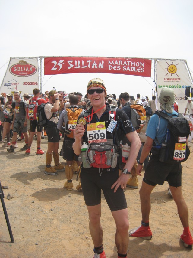 Achim Knacksterdt, chief of the Technical Engineering Section at the U.S. Army Corps of Engineers Europe District, holds up his medal received upon completion of the 25th annual Marathon Des Sables April 10, 2010, in the Sahara Desert. Knacksterdt...