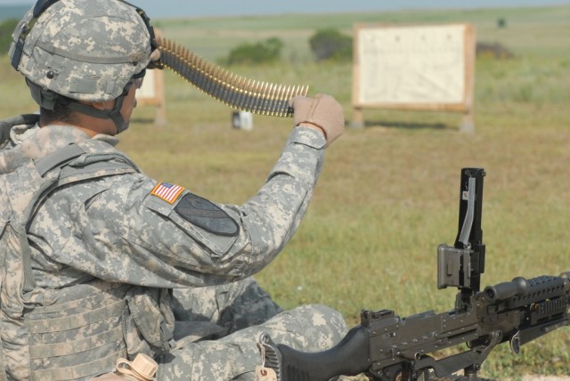 FORT HOOD, Texas - Jacksonville, Fla. native, Spc. Aaron Falk, a scout assigned to the 1st Squadron, 7th Cavalry Regiment, 1st Brigade Combat Team, 1st Cavalry Division, counts rounds to prepare for firing his M240B, May 18. "Garryowen" troops...