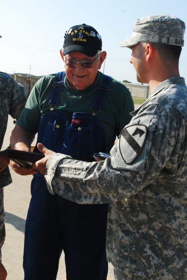 FORT HOOD, Texas-Dean Scantling, a Glennwood, Ala. native, shakes hands with Col. John Peeler, the commander of 2nd Brigade Combat Team, 1st Cavalry Division, after being presented with two certificates, one making him an honorary member of the...