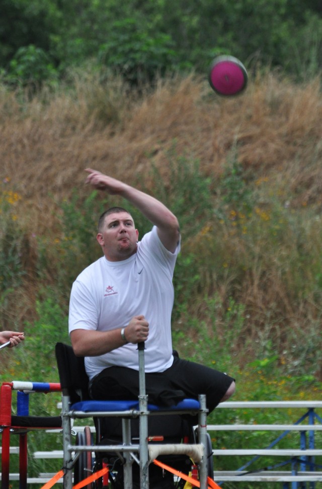 Senior Airman Colton Read throws a discus
