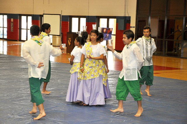 FORT HOOD, Texas-Dancers from the Filipino-American Association perform the dance "Pandango Sa Ilaw" at the Asian/Pacific-Islander Heritage Month observance, here, May 27. The dance symbolizes the wives of the fishermen lighting their husbands...
