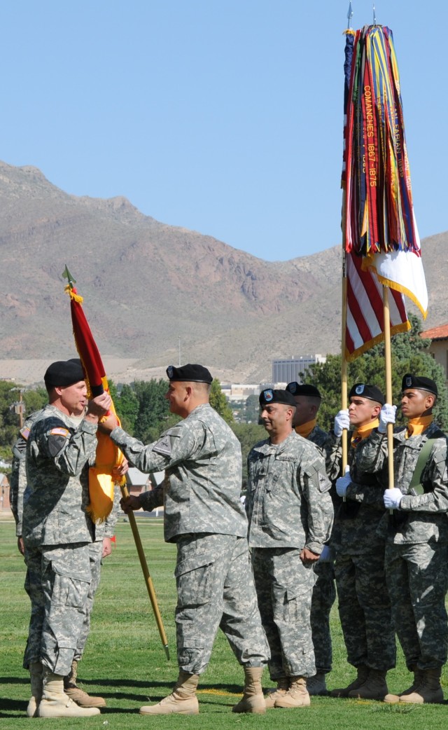 Outgoing AETF Commander Passes Unit Colors to FFID Director
