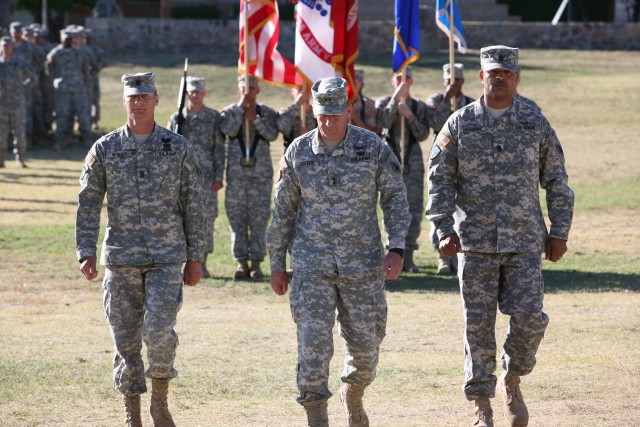 Command Sgt Maj. Gerardus Wykoff, outgoing U.S. Army Intelligence Center of Excellence and Fort Huachuca command sergeant major; Maj. Gen. John Custer, commanding general, USAICoE and Fort Huachuca; and Command Sgt. Maj. Todd Holiday, incoming comman...