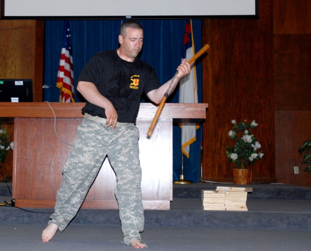 FORT HOOD, Texas-Pfc. Andre Figueroa, of Tacoma, Wash., and a supply specialist for Headquarters and Headquarters Battery 41st Fires Brigade, demonstrates his nun chuck skills during the Asian/Pacific Heritage Celebration, May 26. This year's...