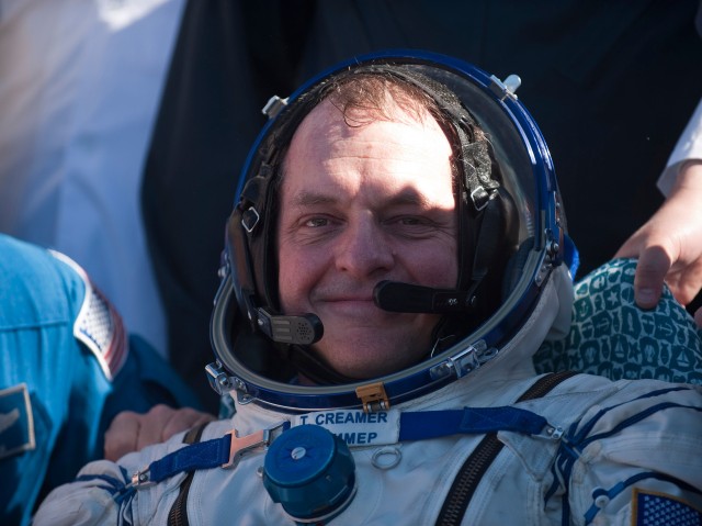 NASA astronaut T.J. Creamer, Expedition 23 flight engineer, sits in a chair outside the Soyuz TMA-17 spacecraft just minutes after he and two crewmates landed in their capsule near the town of Zhezkazgan, Kazakhstan, June 2, 2010. Creamer, along...