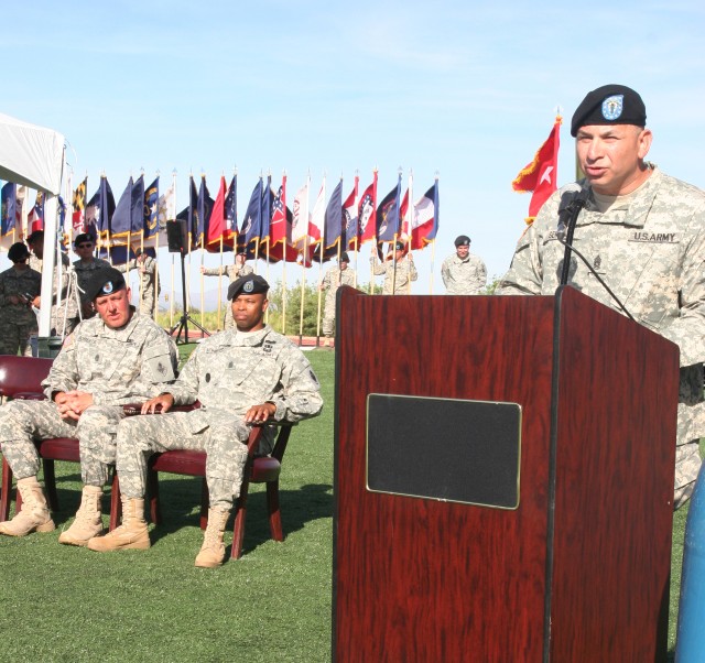 Command Sgt. Maj. Michael Roberts, 111th Military Intelligence Brigade command sergeant major, and Command Sgt. Maj. Christopher Richardson, 309th MI Battalion outgoing command sergeant major, listen as Command Sgt. Maj. Bernardo Serna, 309th MI Batt...