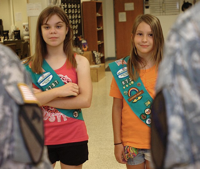 FORT HOOD, Texas - Gillian Herman (left) and Madison Gray, Girl Scouts with Girl Scout Troop 8737, from Frisco, Texas, listen to Chaplain (Lt. Col.) Barbara Sherer, 1st Cav. Div. chaplain, and Sgt. Carla Philpot, 1st Cav. Div. chaplain's...