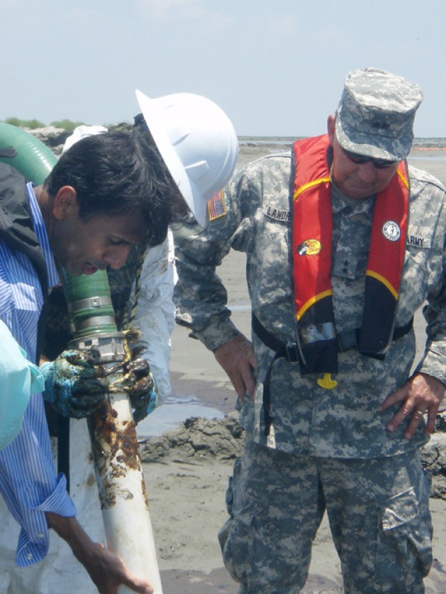 Guard provides 13 vacuum barges to collect oil on coast