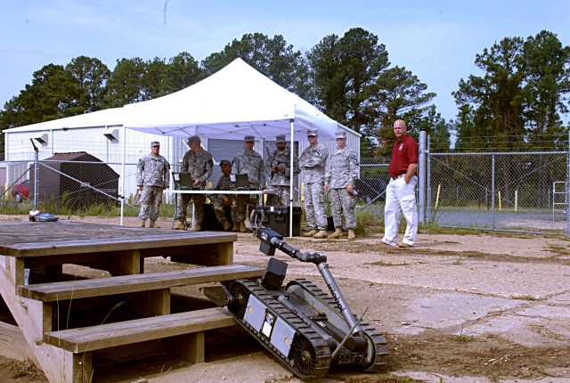 FORT POLK, La. - A "Talon IIIB" robotic system, driven by Soldiers assigned to the 4th Brigade Combat Team, 1st Cavalry Division, maneuvers up a set of stairs, June 8. The Fort Hood troops use this equipment during their robotics pre-rotational...