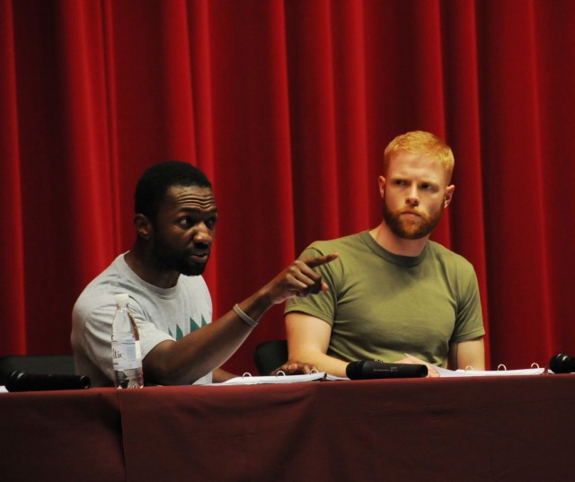 Actors Jamie Hector, left, and Brendan Griffin perform a dramatic reading of the play Ajax, written by Greek playwright Sophocles almost 2,500 years ago. A group of actors with Theater of War Productions visited U.S. Army Garrison Hohenfels, May...