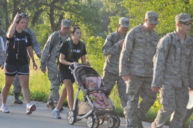 Airmen march in honor of fallen comrade