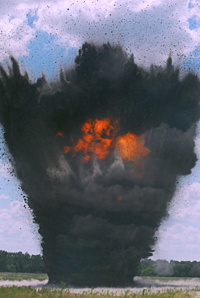 FORT HOOD, Texas- An exploding crater charge creates a massive cloud of smoke and fire- raining dirt in a several hundred food radius during field training conducted by Company C, 2nd Special Troops Battalion, 2nd Brigade Combat Team, 1st Cavalry...