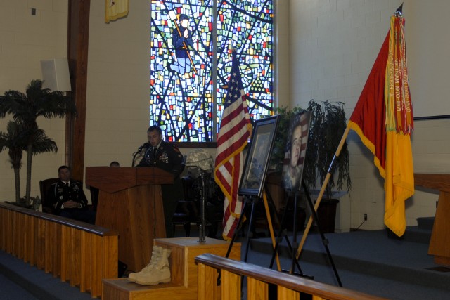 FORT HOOD, Texas—Former Spc. Robert Wells presents a speech at a memorial service for Spc. Robert Rose, of Headquarters and Headquarters Troop, 3rd Brigade Combat Team, 1st Cavalry Division, at the Memorial Chapel, June 22. Wells was a comrade...