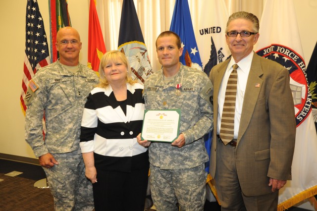 : Maj. Jonathan Graebener receives farewell award Story by Adrienne M. Combs, Deputy Public Affairs Officer