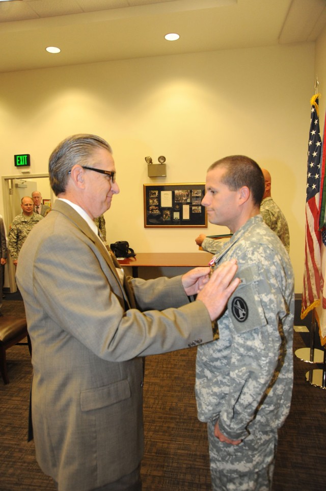 Maj. Jonathan Graebener receives farewell award Story by Adrienne M. Combs, Deputy Public Affairs Officer