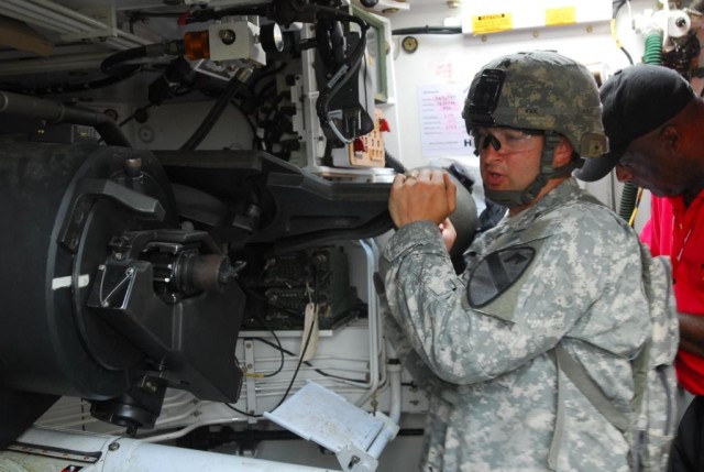 FORT HOOD, Texas- Sgt. Joshua Kee, a Lufkin, Texas native and a cannon crew member with 3rd Battalion., 82nd Field Artillery Regiment, 2nd Brigade Combat Team, 1st Cavalry Division, checks the breach on a self-propelled 155mm howitzer during training...