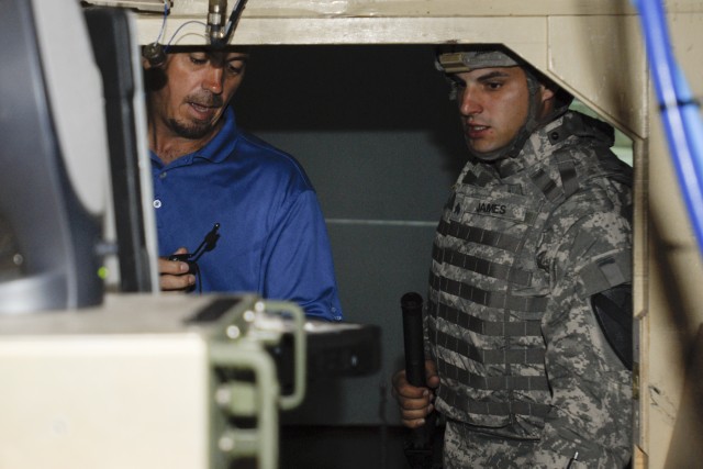 FORT HOOD, Texas-Scott Gurnett (left), a lead Warrior Skills Trainer at Fort Hood's Battle Command Training Center, instructs Sgt. Zachary James, a mechanic with F Forward Support Company, 215th Brigade Support Battalion, 3rd Brigade Combat Team, 1st...