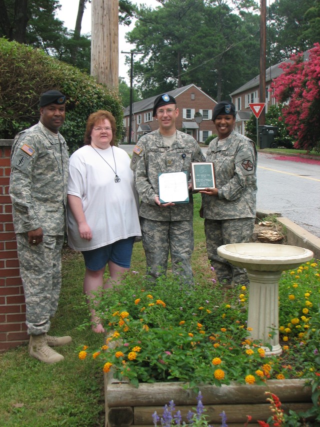 Four families honored for beautifying post