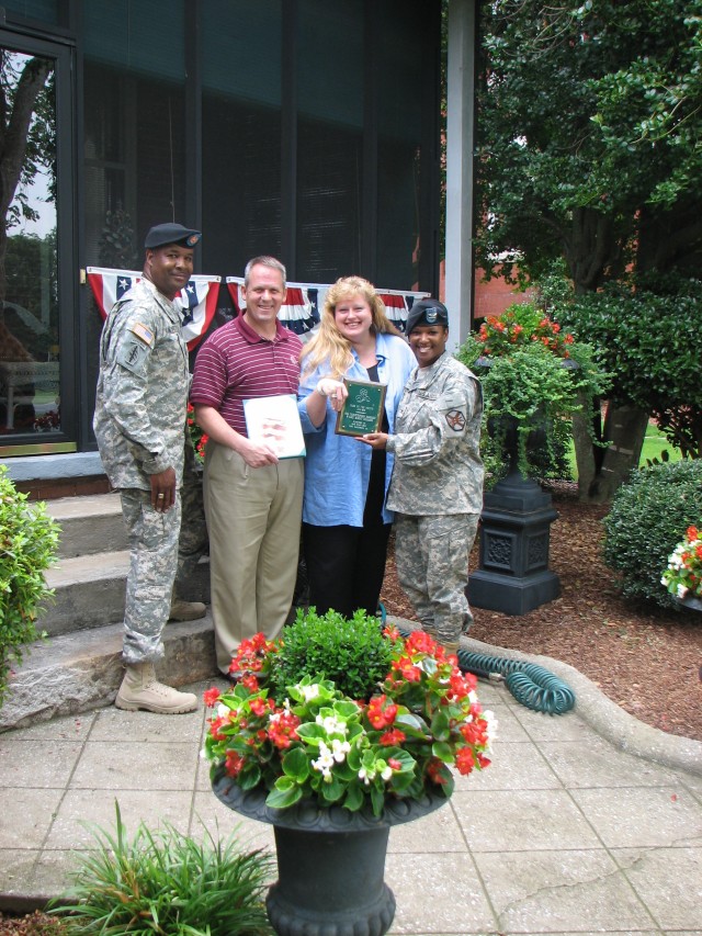 Four families honored for beautifying post