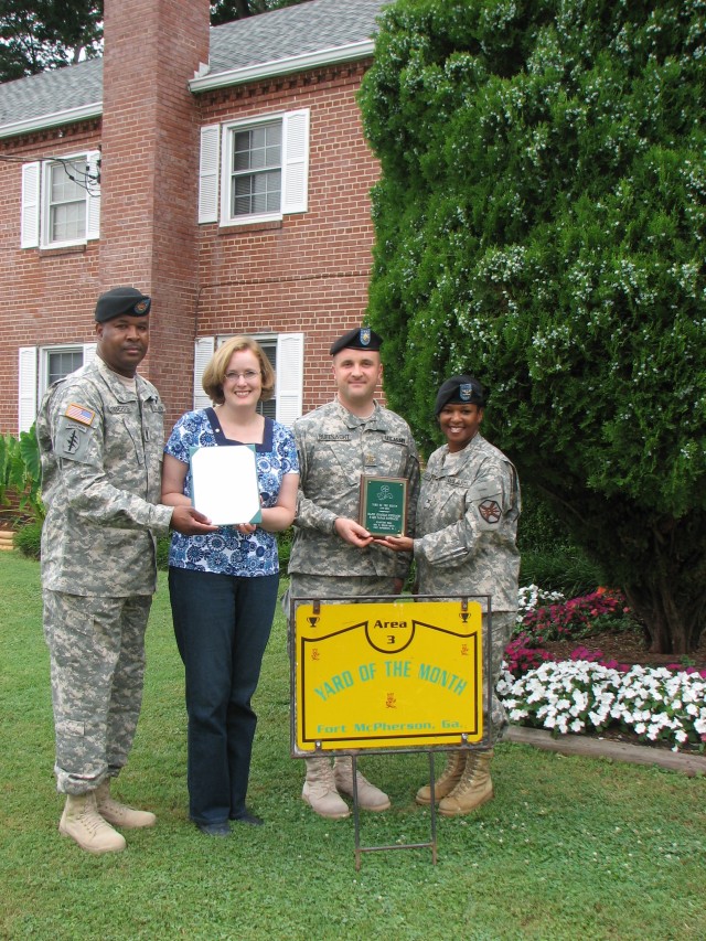 Four families honored for beautifying post