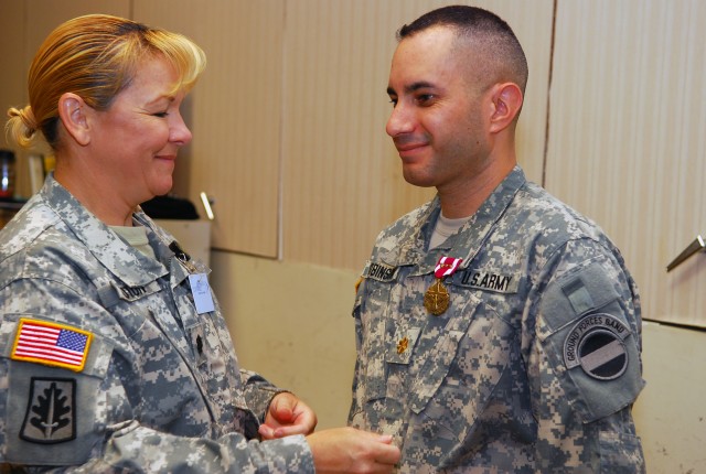 Maj. Robinson is recognized for meritorious service as band&#039;s leader