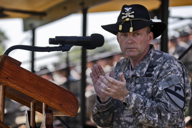 FORT HOOD, Texas-Col. Douglas Gabram, from Cleveland, former commander of the1st Air Cavalry Brigade, 1st Cavalry Division, gives applause to all of the Soldiers and families who supported the efforts of the 1st ACB for the time period that he was in...