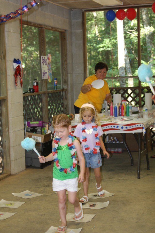 Kylen Delap, granddaughter of Billette Kimbrough (Future War Center),  and Emma Lang, daughter of Sharon Watkins Lang (SMDC Historical Office) walk round and round during "Little Debbie's" Cake Walk hoping to land on the correct animal to win a...