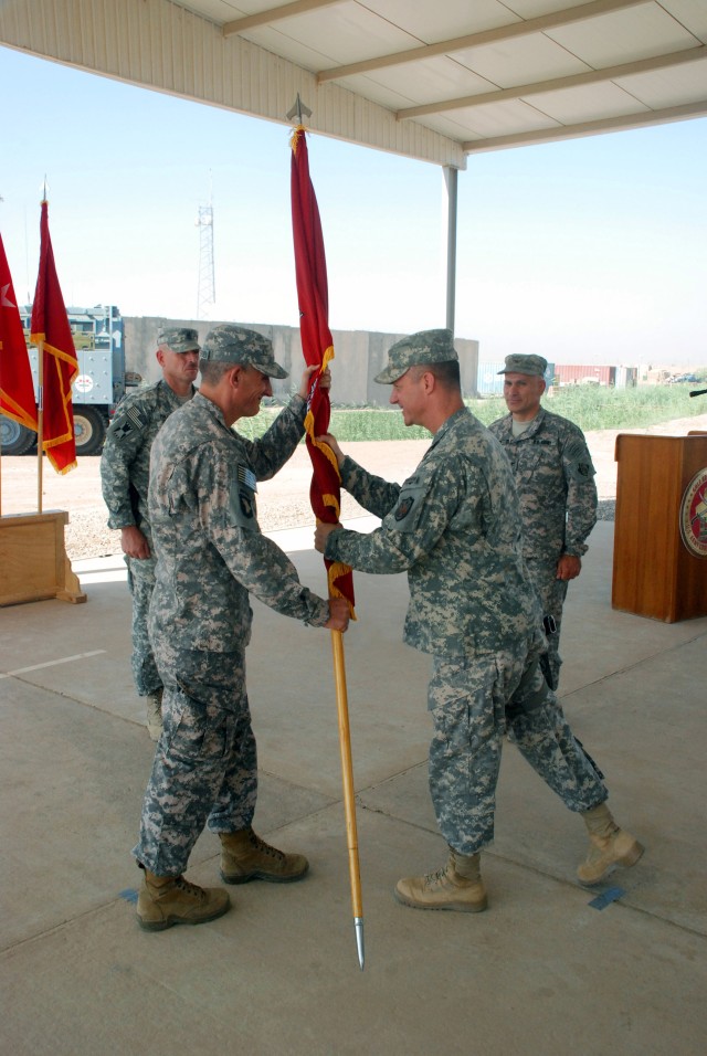 Transatlantic Division Commander Brig. Gen. Kendall Cox passes the flag 