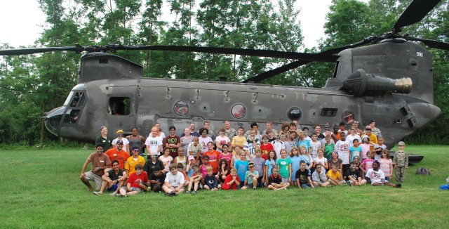 Soldier shares experiences with military camp kids