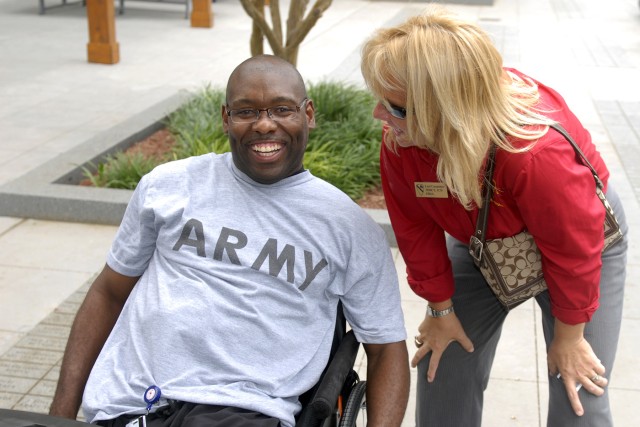 FORT HOOD, Texas - Sgt. 1st Class Charles Armstead, from Needville, Texas, a former platoon sergeant with Company D, 1st Battalion, 12th Cavalry Regiment, 3rd Brigade Combat Team, 1st Cavalry Division, smiles as Lori Carpenter, the 3rd Brigade's Fami...