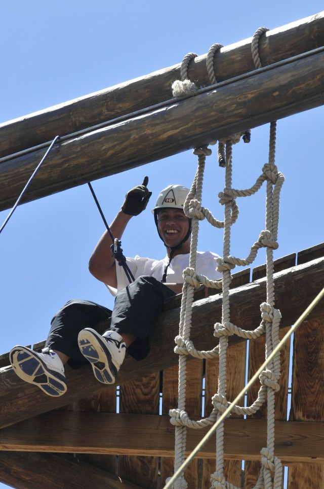 Sgt. Benjamin Maye, human resources sergeant for the 100th Missile Defense Brigade (Ground-Based Midcourse Defense), takes a break at the top of Alpine Tower.  The tower climb was a part of a teambuilding course at the Morale, Welfare and Recreation ...