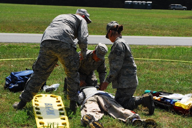 FORT A. P. HILL, Va.-- Airman 1st Class Mariana Hopper and Staff Sgt. Kelly Tyra, with Joint Task Force National Scout Jamboree, take part in a medical exercise in preparation for supporting the 2010 National Scout Jamboree. JTF-NSJ plans and...