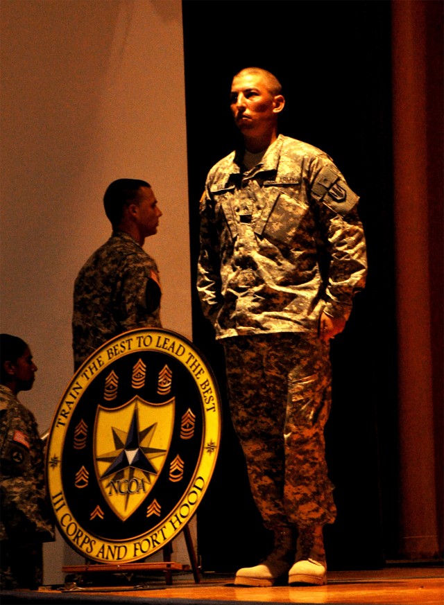 FORT HOOD, Texas-Cpl. Jeremy Wolff, a multiple launch rocket system crew member from Littleton, Colo., with A Battery, 1st Battalion, 21st Field Artillery Regiment, 41st Fires Brigade, wait to receive his certificate during the Warrior Leader...