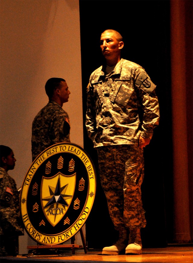 FORT HOOD, Texas-Cpl. Jeremy Wolff, a multiple launch rocket system crew member from Littleton, Colo., with A Battery, 1st Battalion, 21st Field Artillery Regiment, 41st Fires Brigade, wait to receive his certificate during the Warrior Leader Course ...