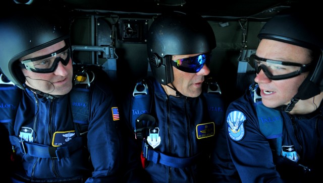 (L to R) Lt. Col. Scott Drinkard, Steve Archuletta and Cadet Jesse Galt, members of the U.S. Air Force Academy Wings of Blue Jump Team, converse during a U.S. Air Force Academy Wings of Blue Jump Team demonstration run July 25. The team will perform ...