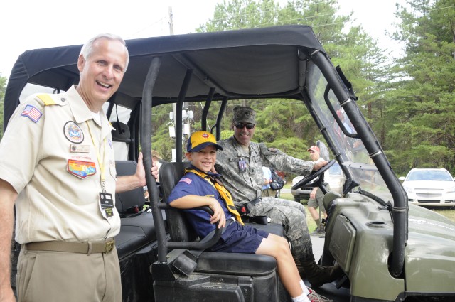 Army Lt. Col John W. Haefner, Fort A.P. Hill commander, his son Luke, pose for a photo with Jim Barbieri, Boy Scouts of America National Scout Jamboree VIP chairman, during the BSA’s NSJ July 27. Colonel Haefner spent the morning touring the Southern...