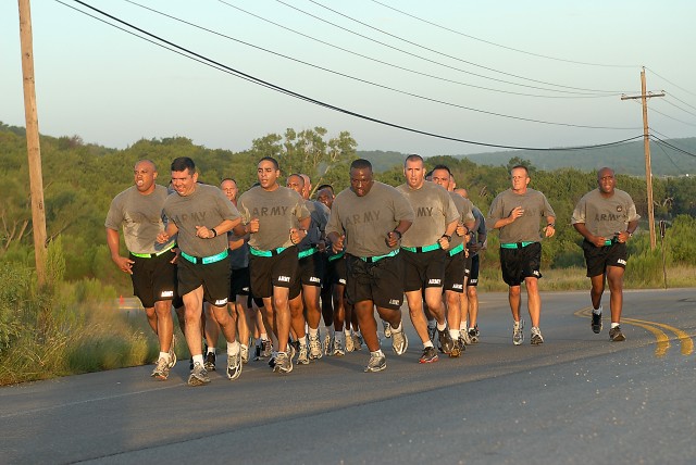 FORT HOOD, Texas - Command Sgt. Maj. Glen Vela, 1st Air Cavalry Brigade, 1st Cavalry Division, leads a run with the 1st ACB Diamond Club - made up of first sergeants and command sergeants major from the 1st ACB - as the sun rises, here, July 30. The ...