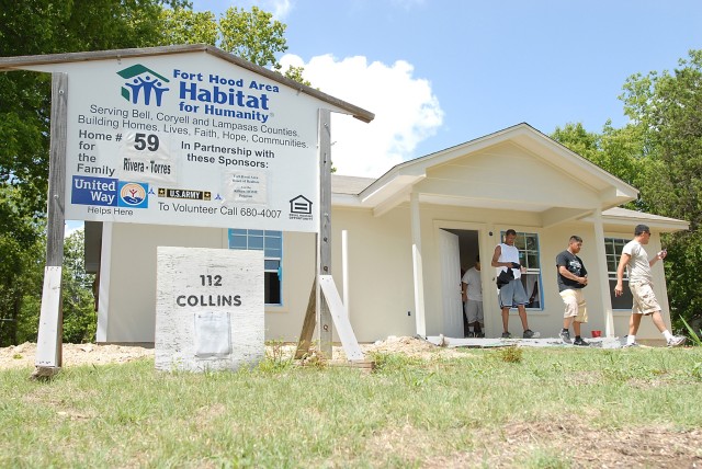 KILLEEN, Texas - Soldiers from A Company, 615th Aviation Support Battalion, 1st Air Cavalry Brigade, 1st Cavalry Division, take a break during their time volunteering for the Fort Hood Area Habitat for Humanity organization, here, July 29. The Soldie...