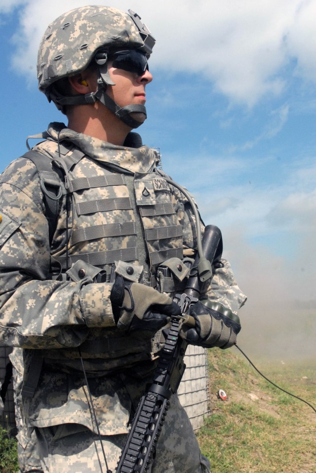 FORT HOOD, Texas - Oconto, Wis. native, Pfc. Bryant Schroepfer, a combat engineer assigned to Company C, 1st Brigade Special Troops Battalion, 1st Brigade Combat Team, 1st Cavalry Division, uses an M81 fuse igniter to detonate the blast during a...