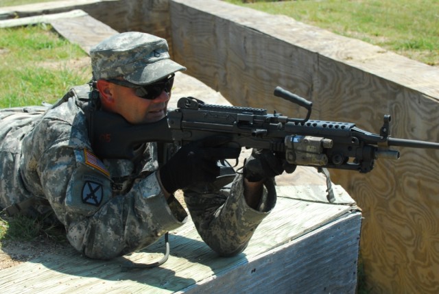 FORT HOOD, Texas- Pfc. Jorge Wickens, a Kill Devil Hills, N.C. native and an infantryman with 2nd Brigade Combat Team, 1st Cavalry Division, provides cover for his team mates during a rehearsal for a live-fire training that focused on building fire t...