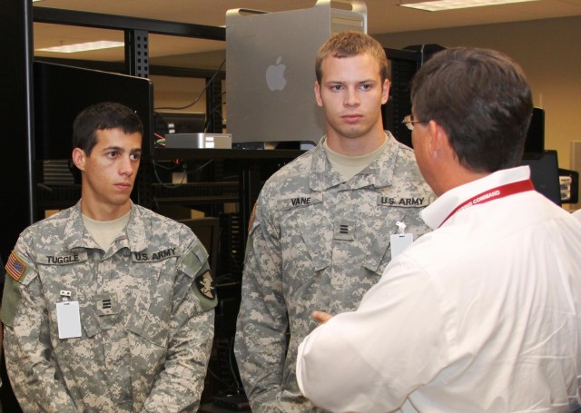 Scott Dennis, Director, ASIF, was one of many AMRDEC employees who helped the cadets learn more about Army Aviation.  Here in the ASIF, Dennis discusses AMRDEC's effort to develop the next generation avionics system architecture with Cadets Vane and ...