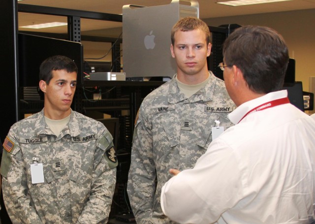 Scott Dennis, Director, ASIF, was one of many AMRDEC employees who helped the cadets learn more about Army Aviation. Here in the ASIF, Dennis discusses AMRDEC's effort to develop the next generation avionics system architecture with Cadets Vane...